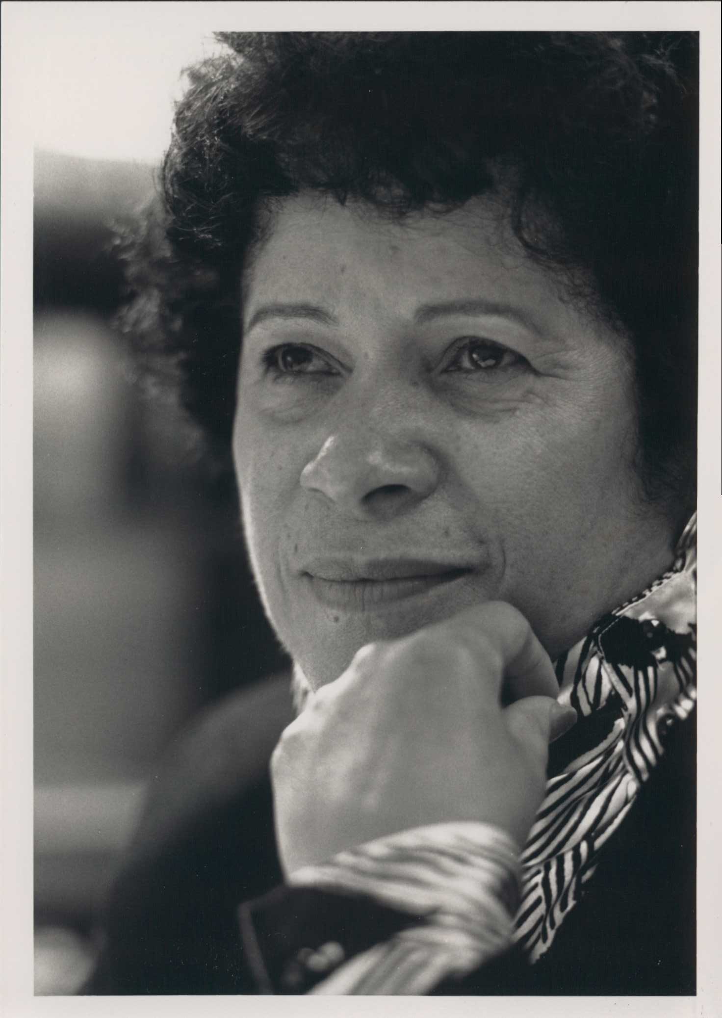 Dr. Mercile J. Lee with her hand on her chin in a black and white photograph.